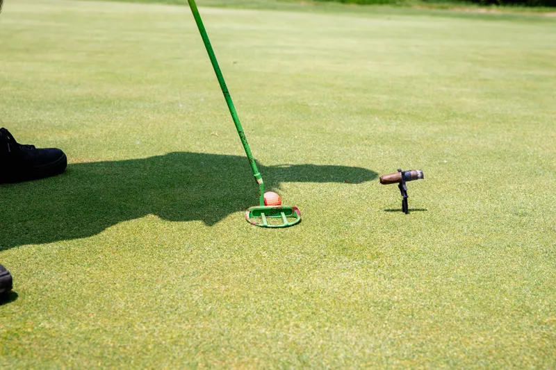 Putt & Puff in use on the golf course while putting